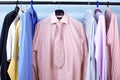 Mix color Shirt and Tie on Hangers Royalty Free Stock Photo