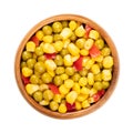Mix of canned corn, green peas and diced red bell pepper, in a wooden bowl Royalty Free Stock Photo