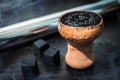 A mix of craft hookah tobacco in a clay bowl for shisha. Royalty Free Stock Photo