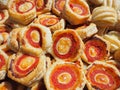 Mix of delicious appetizers and small pizzas made of puff pastry Royalty Free Stock Photo