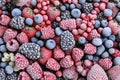 Mix of different frozen berries as background