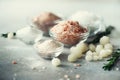 Mix of different salt types on grey concrete background. Sea salts, black and pink Himalayan salt crystals, powder Royalty Free Stock Photo