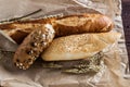 Mix of different varieties of bread lying on a wooden table Royalty Free Stock Photo