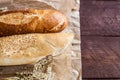 Mix of different varieties of bread lying on a wooden table Royalty Free Stock Photo