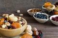 Mix of dried fruits and nuts in a bowl on rustic wooden background Royalty Free Stock Photo