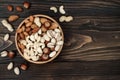 Mix of dried fruits and nuts on a dark wood background with copy space. Top view. Symbols of judaic holiday Tu Bishvat. Royalty Free Stock Photo