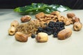 Mix dry fruits nuts around dates isolated almonds black and brown raisinskishmish Royalty Free Stock Photo