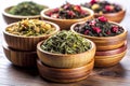 Mix of Dry Green and Flower Tea in Bamboo Bowls Royalty Free Stock Photo