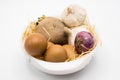 Mix of egg potato onion and garlic on the nest with white background