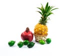 Mix of exotic fruits pineapple feijoa and pomegranate, set, on white isolated background