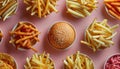 A mix of French fries and a hamburger on a pink backdrop, junk food delight Royalty Free Stock Photo