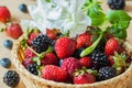 Mix of fresh berries , blueberries, strawberries, raspberries and blackberries, in wicker bowl Royalty Free Stock Photo