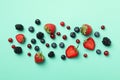 Mix of fresh berries on mint background top view Royalty Free Stock Photo