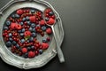 Eating Berries fruits with spoon Royalty Free Stock Photo