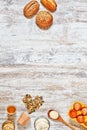 Mix of fresh bread and ingredients on a wooden table. Vertical. Royalty Free Stock Photo