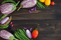 Mix of fresh farmers market vegetable from above on the old wooden board with copy space. Healthy eating background. Top view Royalty Free Stock Photo