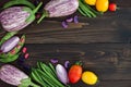 Mix of fresh farmers market vegetable from above on the old wooden board with copy space. Healthy eating background. Top view Royalty Free Stock Photo