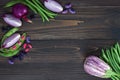 Mix of fresh farmers market vegetable from above on the old wooden board with copy space. Healthy eating background. Top view Royalty Free Stock Photo