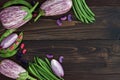 Mix of fresh farmers market vegetable from above on the old wooden board with copy space. Healthy eating background. Top view Royalty Free Stock Photo