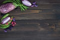 Mix of fresh farmers market vegetable from above on the old wooden board with copy space. Healthy eating background. Top view Royalty Free Stock Photo