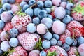 Mix of frozen berries, blueberries, strawberries, black currants, gooseberries. Close-up, top view. Background Royalty Free Stock Photo