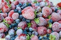 Mix of frozen berries, blueberries, strawberries, black currants, gooseberries. Close-up, top view. Background Royalty Free Stock Photo