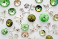 Green and gold crystals and metal bees and flowers and dragonflies on white background Royalty Free Stock Photo