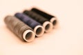 mix of grey, blue and black colored threads on white background - close up Royalty Free Stock Photo