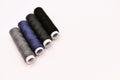 mix of grey, blue and black colored threads on white background - close up photography Royalty Free Stock Photo