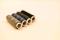 mix of grey, blue and black colored threads on white background Royalty Free Stock Photo