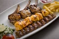 Mix grill platter of chicken tikka kabab, beef kebab and lamb chop served in dish isolated on grey background top view of arabic