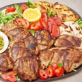 Mix grill platter of chicken tikka kabab, beef kebab and lamb chop served in dish isolated on grey background top view of arabic