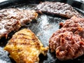 Mix of grilled meat cooked on lava stone