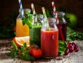 Mix of healthy fruit and vegetable juices in small bottles with Royalty Free Stock Photo