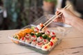 Mix japanese sushi rolls in take away package Royalty Free Stock Photo