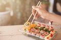 Mix japanese sushi rolls in take away package Royalty Free Stock Photo