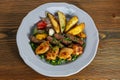 Mix kofta and shish tawook kabab with potato veggies, tomato, onion and coriander served in dish isolated on table top view of Royalty Free Stock Photo