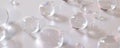 A mix of large and small bubbles floating randomly on a clean white canvas, each