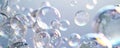 A mix of large and small bubbles floating randomly on a clean white canvas, each