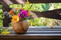 Mix of medicinal herbs in a mortar in a garden