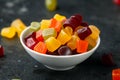 A mix of Midget Gems candy in white bowl. sweet food