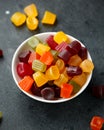 A mix of Midget Gems candy in white bowl. sweet food