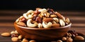 Mix nuts Cashew, hazelnuts, walnuts, almonds, brazilian nuts and pine nuts in bowl on wooden background