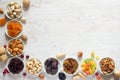 Mix of nuts and dried fruits in small bowls. Healthy and tasty snack Royalty Free Stock Photo