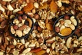 Mix of nuts and dried fruits on a wooden board and in a bowl. Healthy sweets Royalty Free Stock Photo