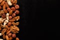 Mix of nuts frame on a black table Royalty Free Stock Photo