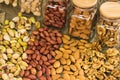 Mix of nuts in the glass jars , on the table Royalty Free Stock Photo