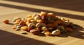 A Mix of Nuts, Seeds and Dried Fruit on Wooden Table in Sunlight Royalty Free Stock Photo