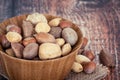 Mix nuts in a wooden bowl Royalty Free Stock Photo