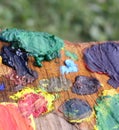 Mix of paints on handmade wooden palette.